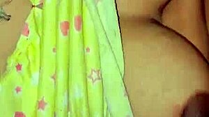 The deshi bhabi was playing with her big boobs at home