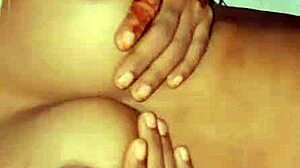 The deshi bhabi was playing with her big boobs at home