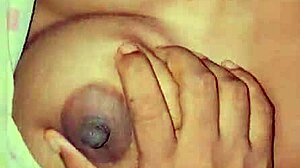 The deshi bhabi was playing with her big boobs at home