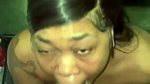 She's sucking that big black cock in front of the fridge, sloppy and deep