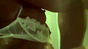 She's sucking that big black cock in front of the fridge, sloppy and deep