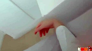 The sexy stepmom shares the bed with her stepson, masturbating right next to him.