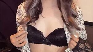 japanese ladyboy masturbates quietly in one-piece dress