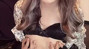 japanese ladyboy masturbates quietly in one-piece dress