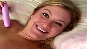 She Plays with Toy on Bed