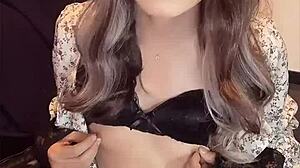 japanese ladyboy masturbates quietly in one-piece dress