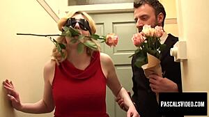 i this blonde is really romantic with the rose in her mouth and kinky with a blindfold over her eyes