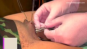 Pierce Rosie's pussy, Mistress April commands dominantly.