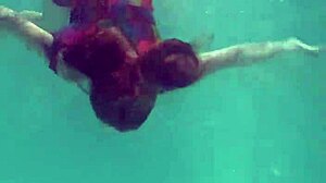 Redhead nikita vodorezova strips naked quick underwater at beach