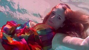 Redhead nikita vodorezova strips naked quick underwater at beach