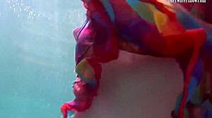 Redhead nikita vodorezova strips naked quick underwater at beach