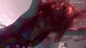 Redhead nikita vodorezova strips naked quick underwater at beach