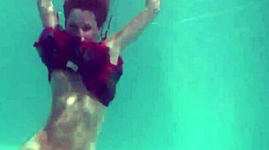 Redhead nikita vodorezova strips naked quick underwater at beach