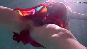 Redhead nikita vodorezova strips naked quick underwater at beach