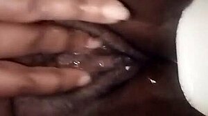 dark juicy folds glisten inviting deep exploration of black pussy depths