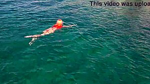 Skinny babe flashes shaved wet pussy by blue water outdoors!