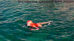 Skinny babe flashes shaved wet pussy by blue water outdoors!