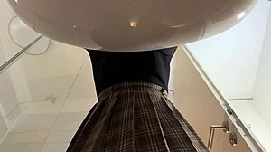 hey check out this big tits blonde in heels and pantyhose stripping her miniskirt off in the bathroom