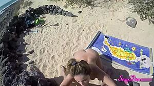 sun-soaked beach seduction unfolds as tanned beauty strips, shakes ass, then takes pov doggystyle pounding from monster cock