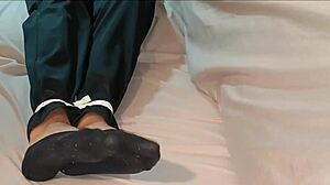 asian korean babe ties herself up in socks for bdsm self bondage before nap