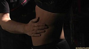 Redhead Bound in Latex Endures Candle Wax on Pussy During Outdoor BDSM Spanking