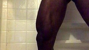 black dude strokes monster cock in homemade shower solo