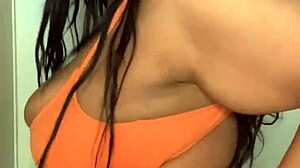 Bikini-Clad Ebony Milf Dances with Massive Tits Swinging