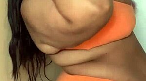 Bikini-Clad Ebony Milf Dances with Massive Tits Swinging