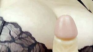 blonde bombshell slips into lingerie flaunting her massive natural tits