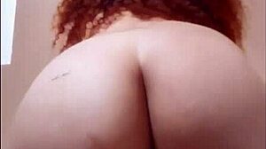 curly redhead shakes her huge ass teasing my throbbing cock