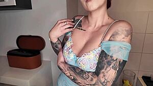 Sexy Redhead in Latex Shows Off Big Tits and Ass