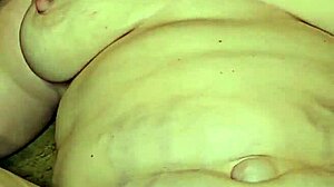 Thick milf's big tits bounce as she gets foot fucked hard by fetish lover.