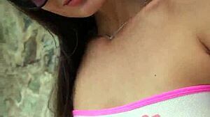 cute brunette babe chills in bikini flashing at public beach