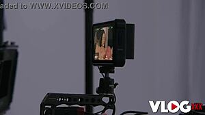 Lovely Kama Oxi bares her shaved pussy and small tits backstage, deepthroating big cock in stockings after photoshoot