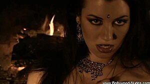 Watch this seductive brunette rip clothes in erotic dance!