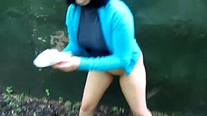 Milf stands and pisses behind garages, dirty shaved pussy urinates publicly!