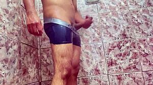 young guy teases huge bulge under shorts outdoors
