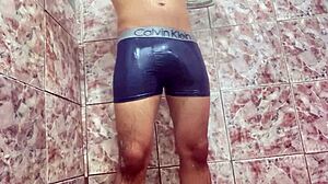 young guy teases huge bulge under shorts outdoors