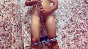 young guy teases huge bulge under shorts outdoors