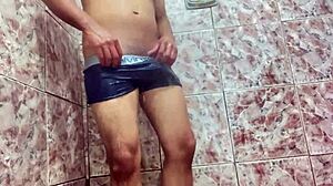 young guy teases huge bulge under shorts outdoors