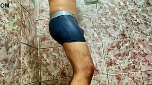 young guy teases huge bulge under shorts outdoors