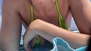 Italian Milf Artemisia Love Flaunts Big Tits in Bikini on Public Beach
