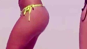 micro bikini hides young girl's huge ass as boyfriend's relatives watch on beach