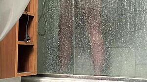 bbw gets caught stroking her fat pussy in the steamy shower