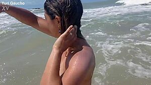 yuri gaucho wife struts her curves on nudist beach as crowd goes wild for every jiggle