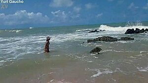 yuri gaucho wife struts her curves on nudist beach as crowd goes wild for every jiggle