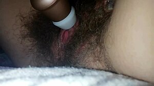 Hairy pussy clit throbs in bed vibrator orgasm closeup