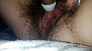 Hairy pussy clit throbs in bed vibrator orgasm closeup