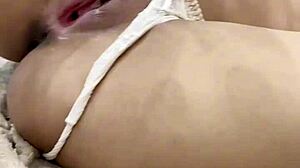 her tight pussy throbs with need as the dildo stretches her deep inside aching for more