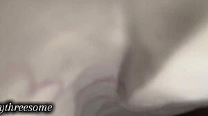 real couple caresses under blanket sheets teasingly